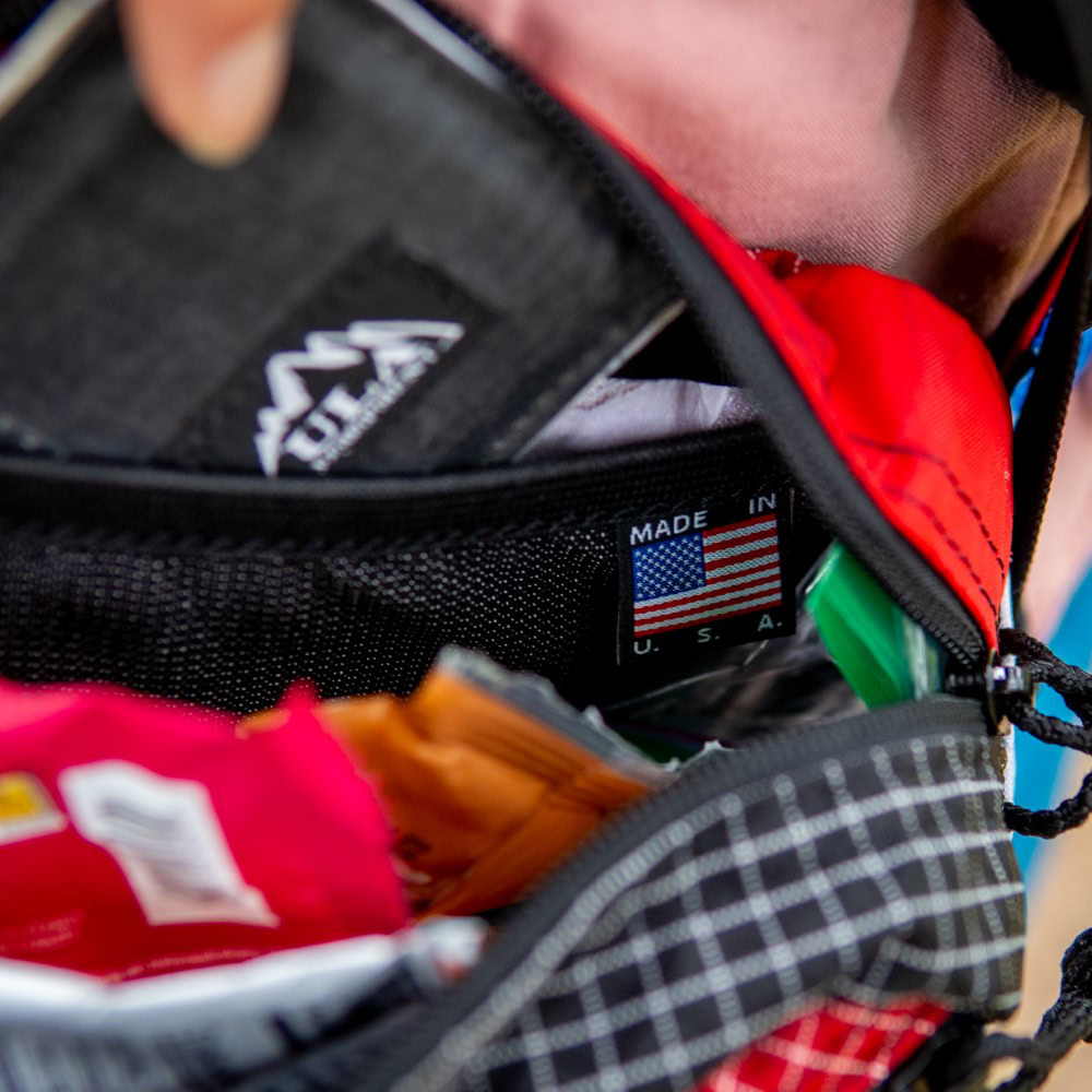 Backpacker looks in spacious inner compartment of Entropy Spare Tire Waist Pack