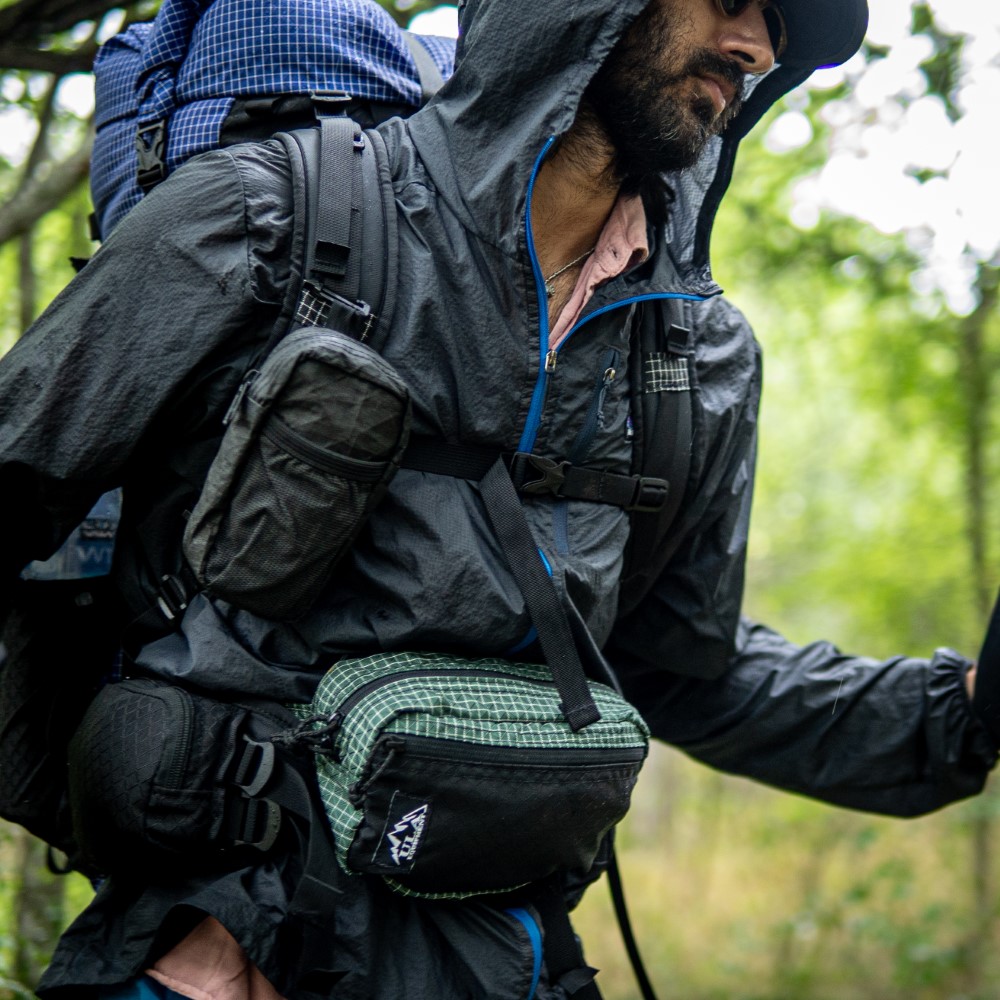 Backpacker wears Spare Tire Waist Pack while backpacking for additional, easy to access storage