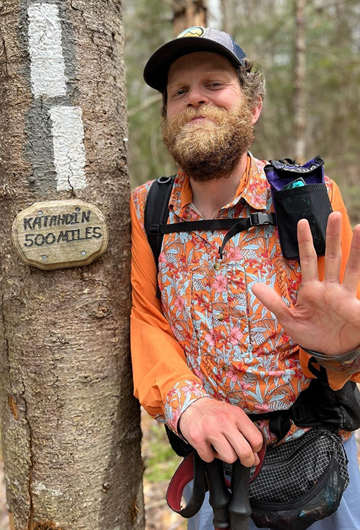 Backpacker puts a Bear Vault Bear Canister into a ULA CDT Backpack