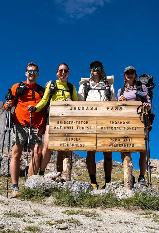 A BearVault being opened by a hiker. The BearVault also keeps your snacks from getting crushed.