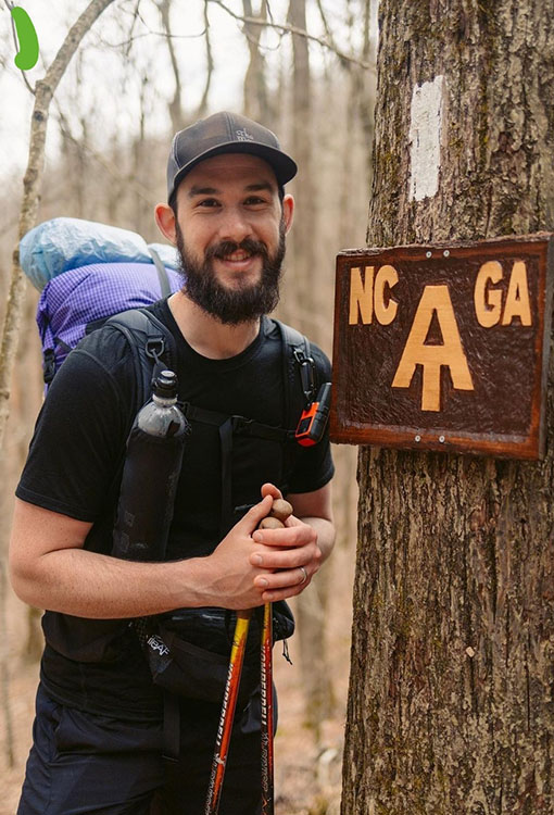 Backpacker puts a Bear Vault Bear Canister into a ULA CDT Backpack